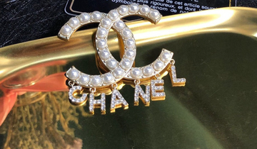 CC dangling brooch